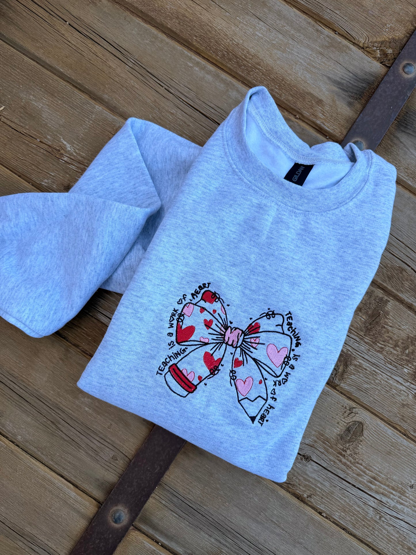 EMBROIDERED "teaching is a work of heart" crew