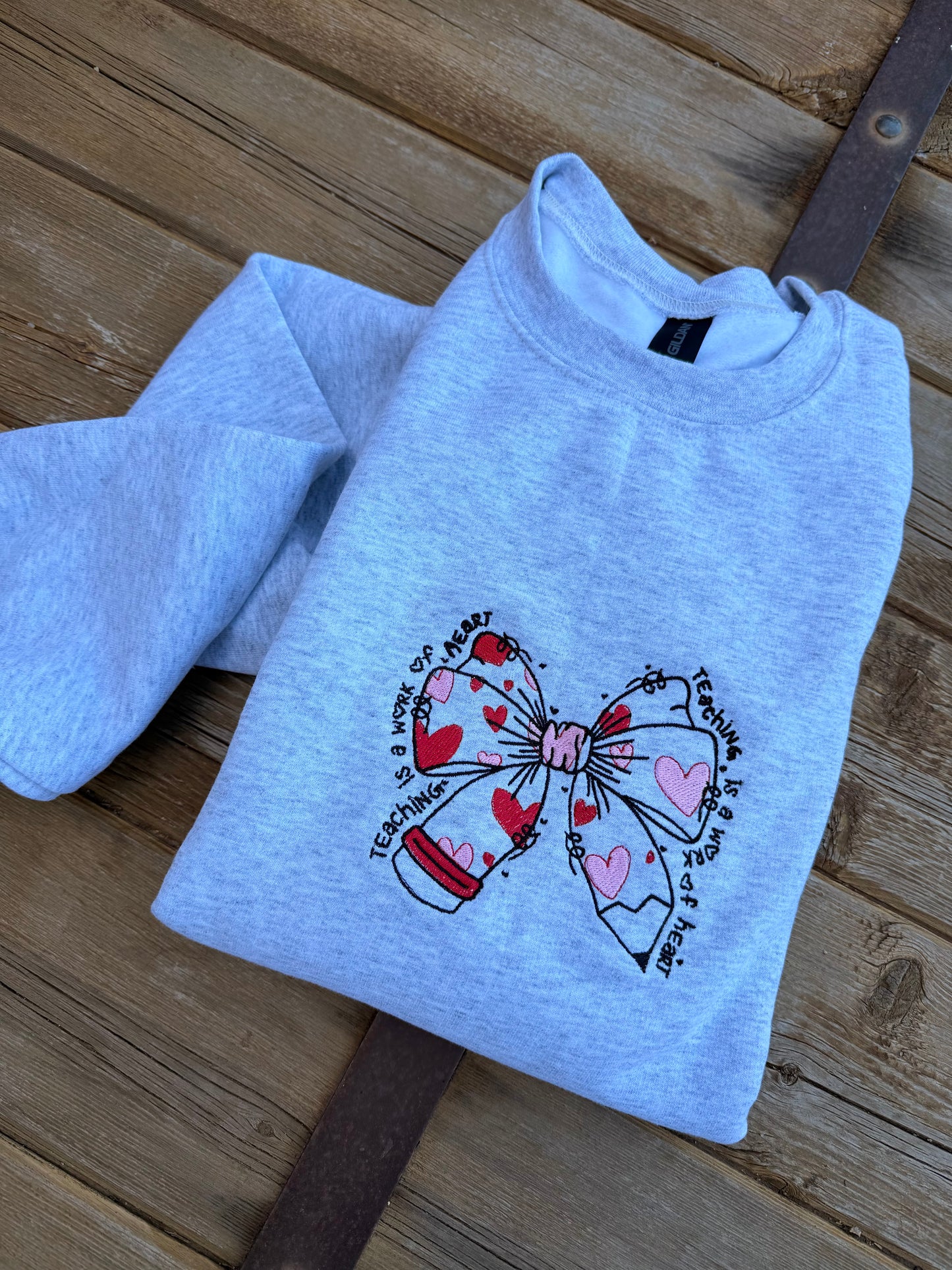 EMBROIDERED "teaching is a work of heart" crew